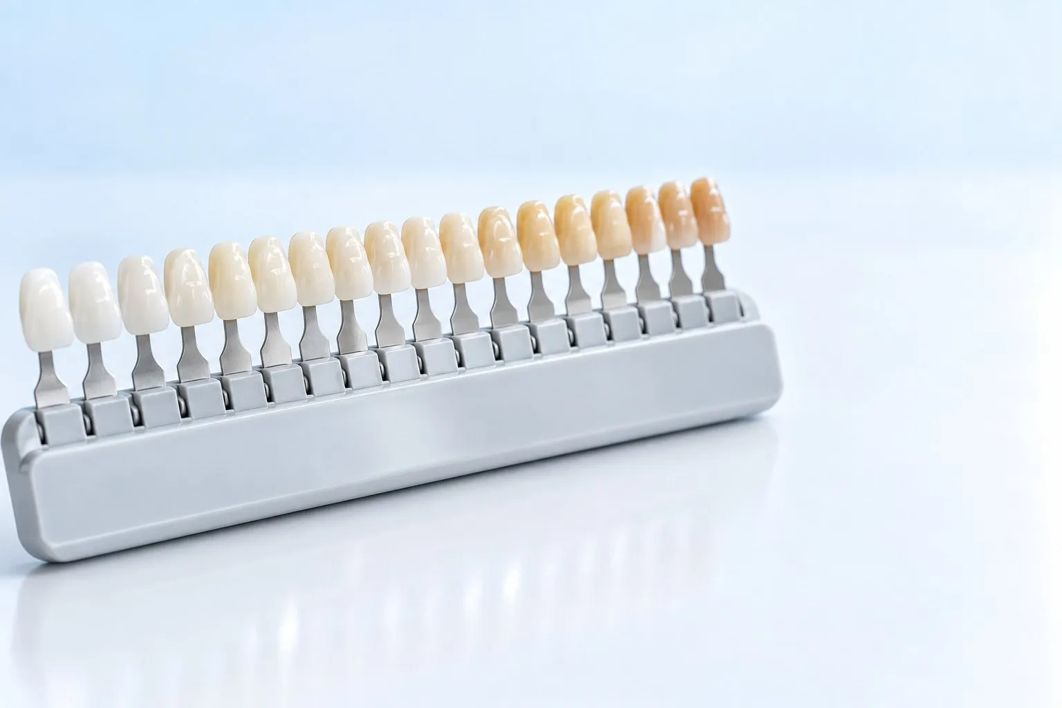 A dental shade guide arranged from light to dark