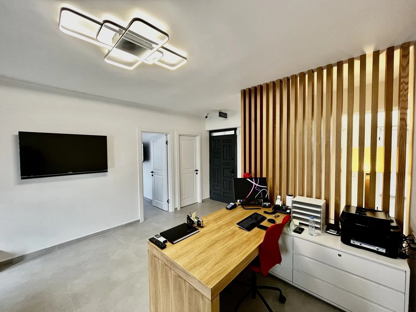 Reception desk and doors leading to the treatment rooms