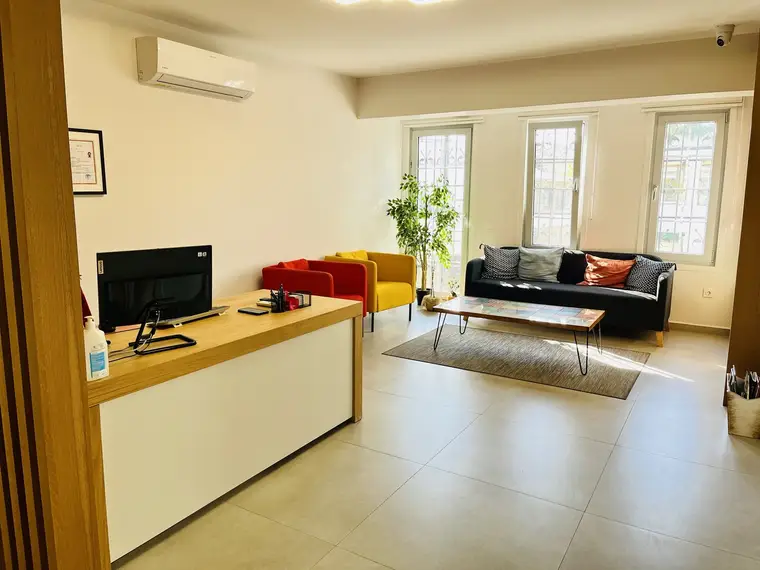 Waiting area and reception desk of the practice
