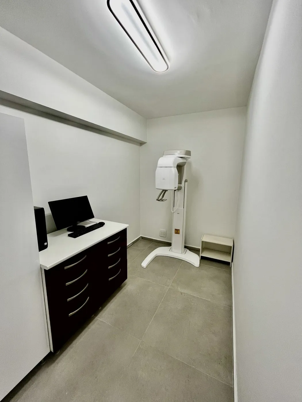 X-ray room: panoramic X-ray unit and the computer used to review the images